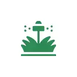 Here's an alt tag for the image: `Sprinkler watering green grass`