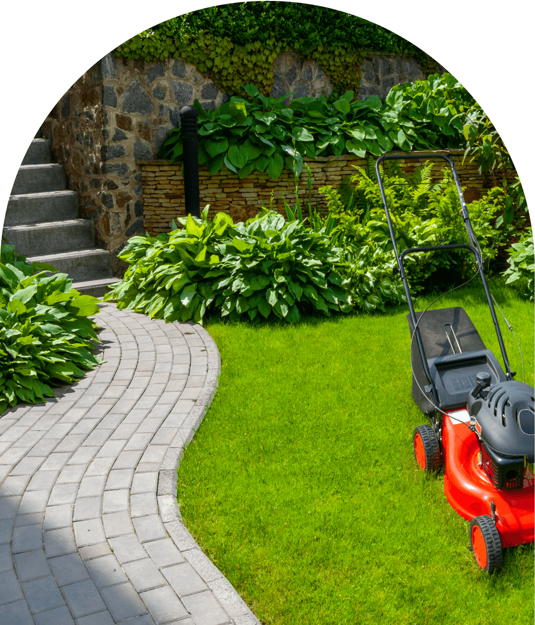 Red lawnmower on a manicured lawn.